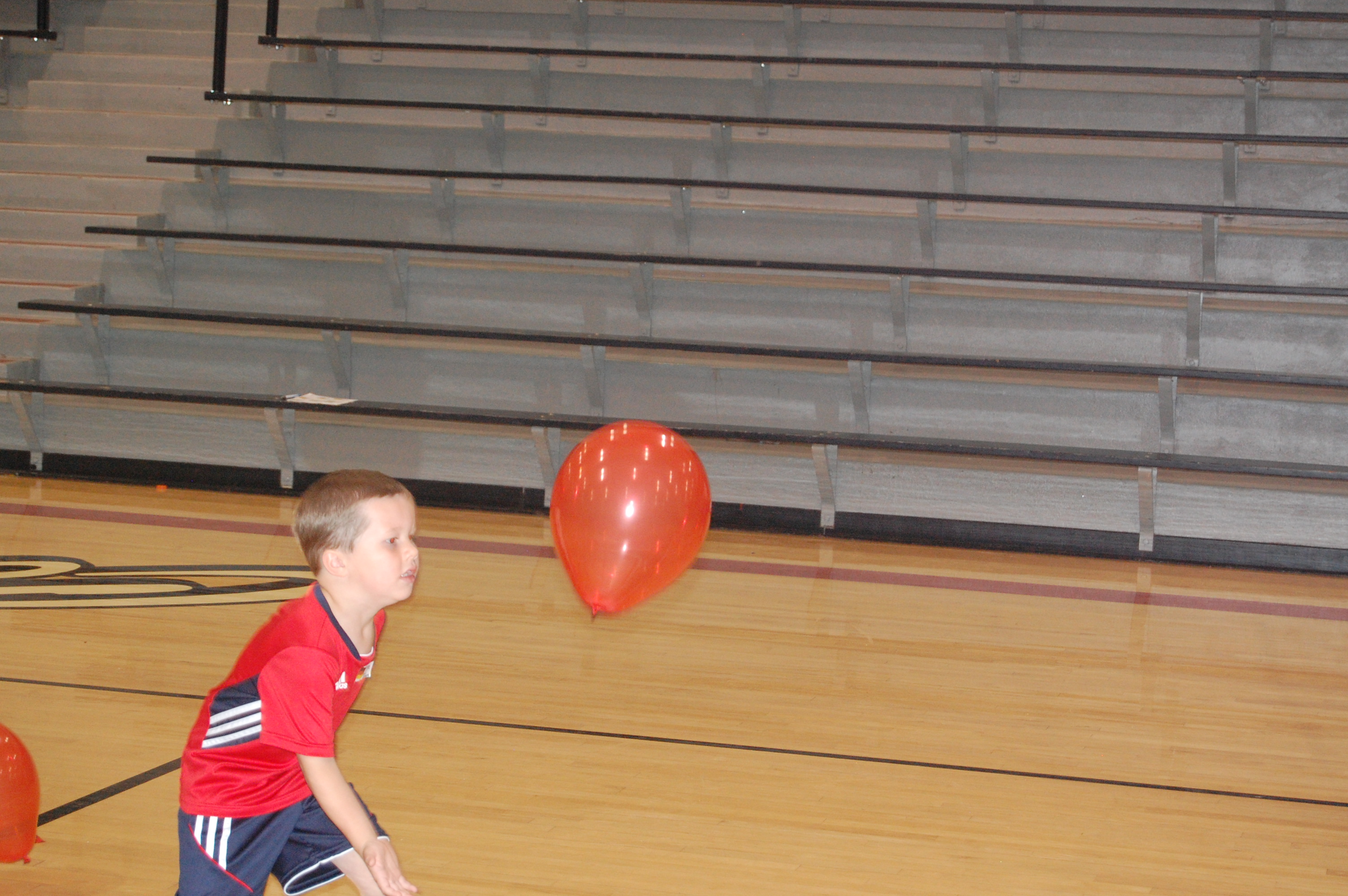Colton playing with a balloon